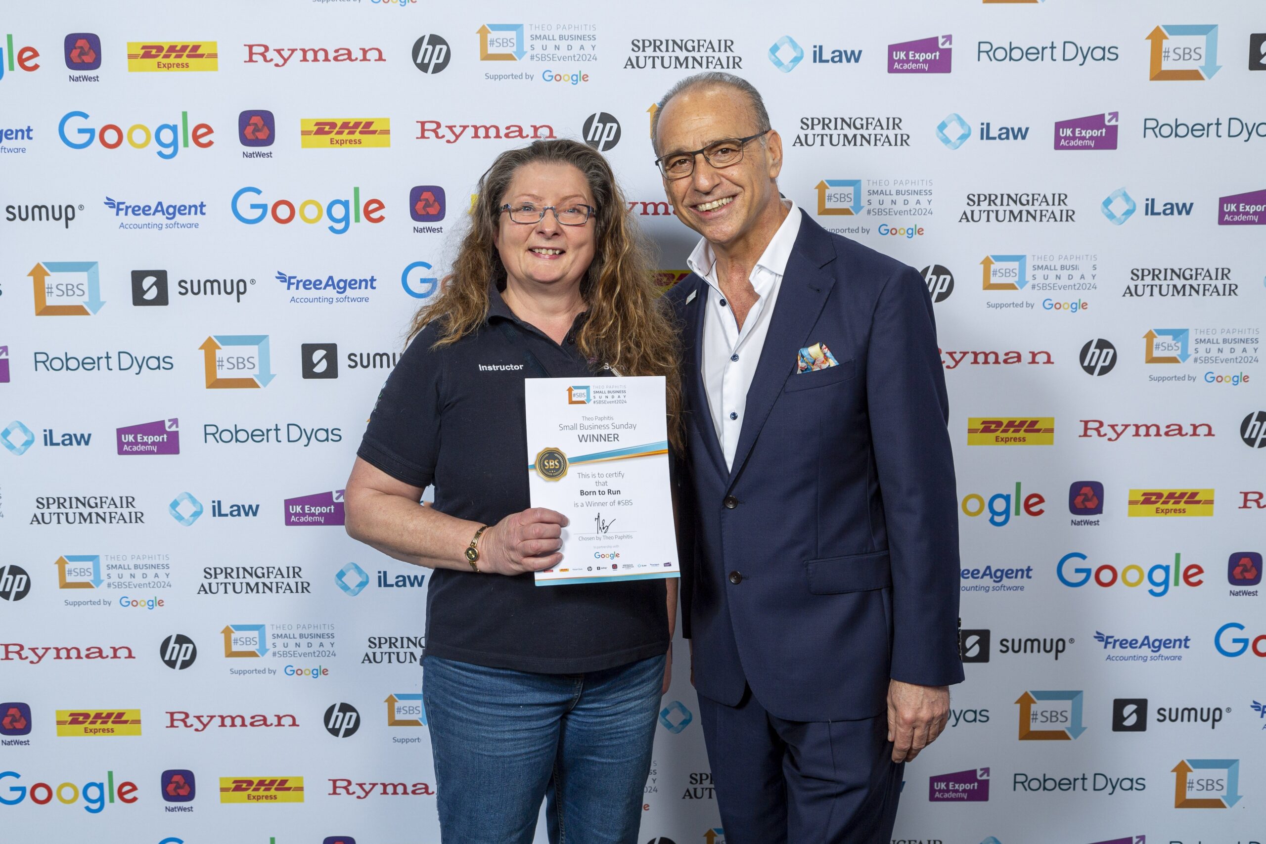 angela day receiving her award from Dragons Dens Theo Paphitis